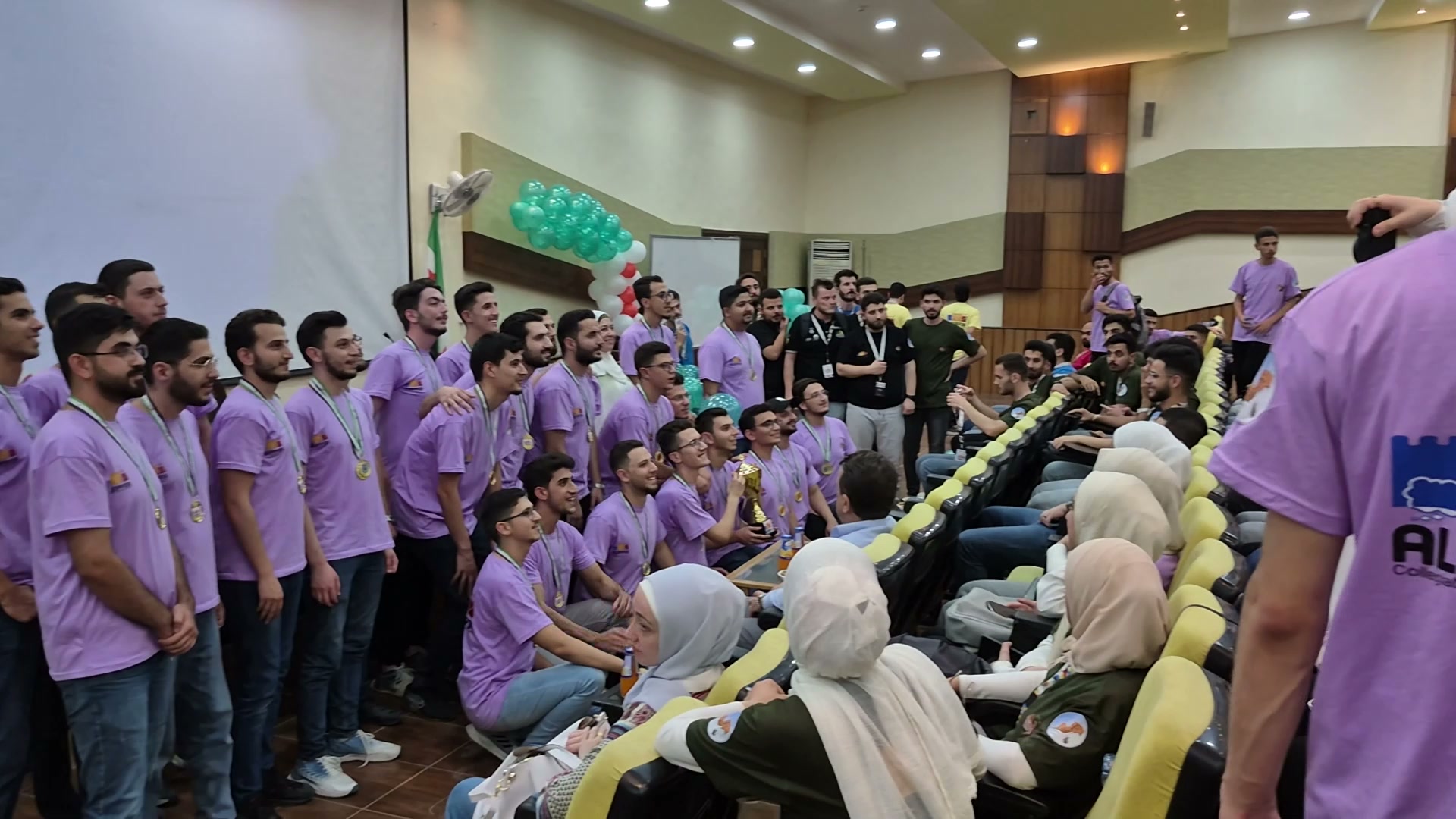 Club members and organizers in a group photo after the contest